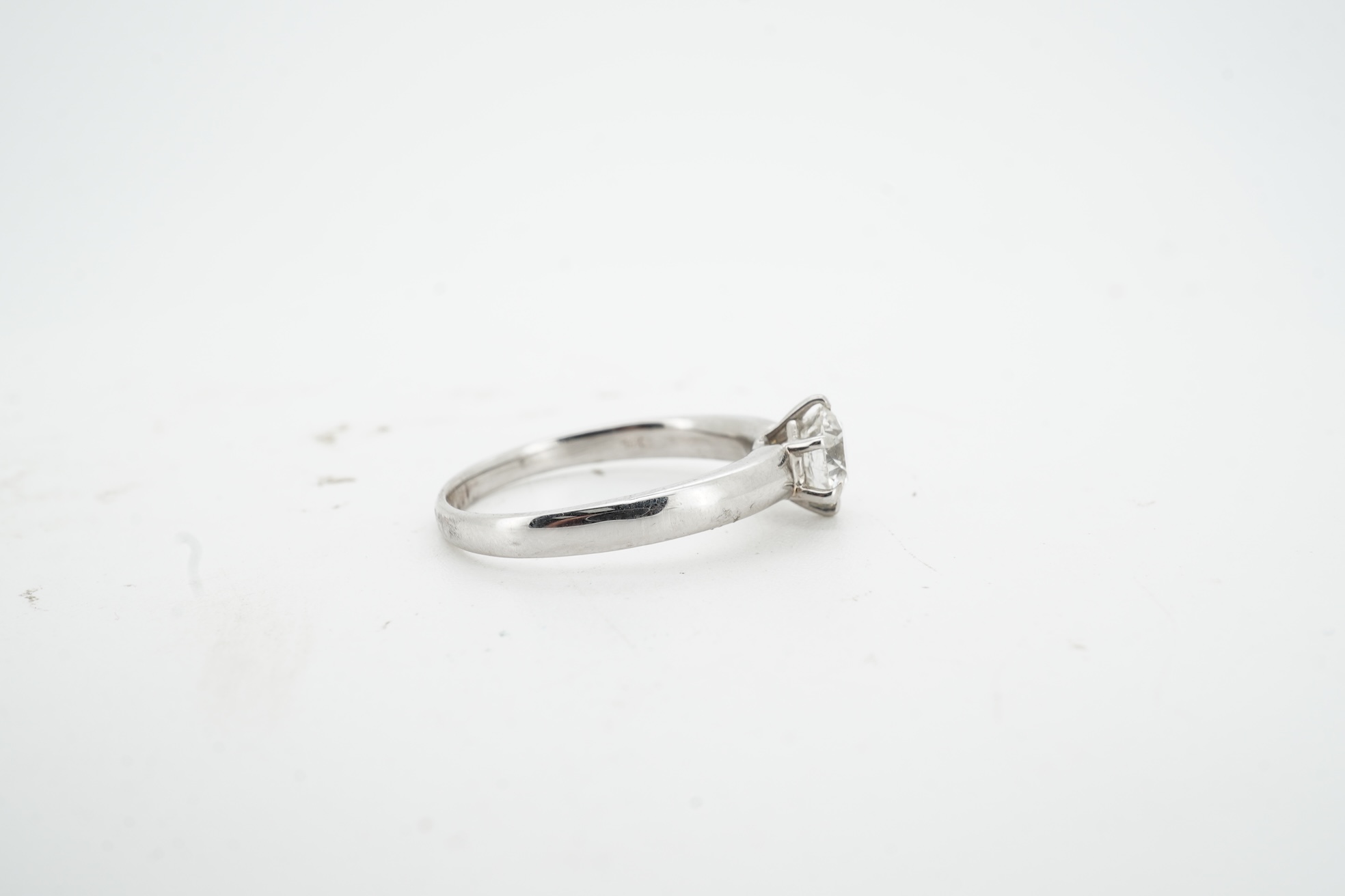 A diamond ring, claw-set with a brilliant-cut diamond weighing approximately 0.80 carats, mounted in white gold, size M, stamped 14K, gross weight approximately 3 grams